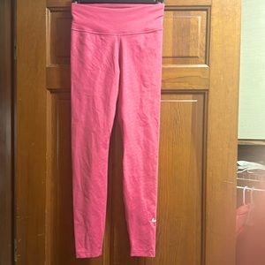 Nike Dri-fit women’s leggings with swoosh pattern salmon color